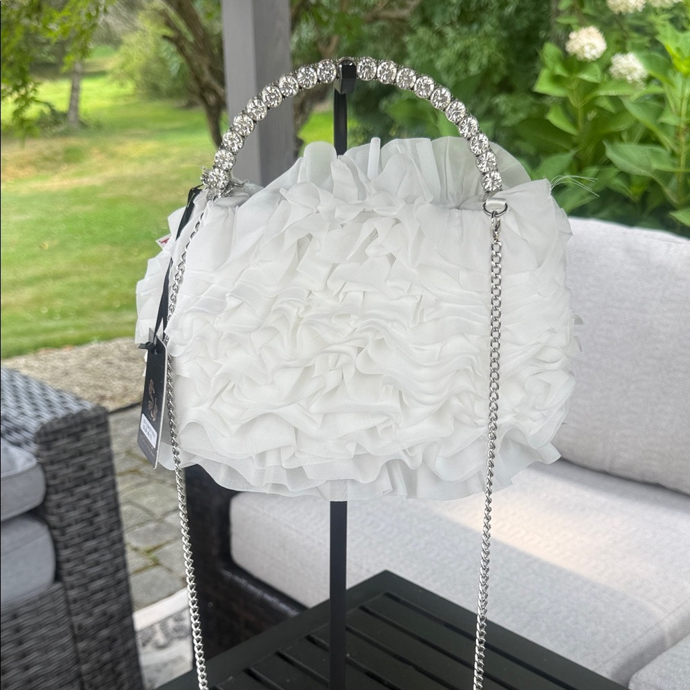 Sincerely Jules, silver rhinestone and white ruffled satchel